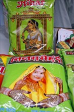 INDIA, Rajasthan, Jodhpur, Plastic packets of henna for sale illustrated with pictures of