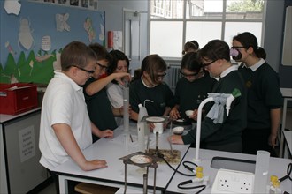 CHILDREN, Education, Secondary, Food technology science pupils carrying out an experiment to