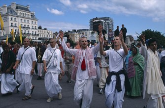 ENGLAND, East Sussex, Brighton, Hare Krishna taking part in a parade on Brighton seafront