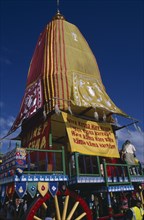 ENGLAND, East Sussex, Brighton, Hare Krishna taking part in a parade on Brighton seafront  with a