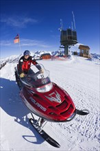 20091051 Ski Patrol Skidoo motorised snow mobile. Model Released American Cell Cellular Holidaymakers North America One individual Solo Lone Solitary Tourism Tourist United States America  Dominant Re...