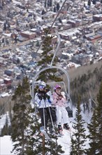 20091053 Skiers ski lift chair. American North America United States America  WeatherTravelTransportPeople - GroupLeisure ActivitiesDominant WhiteDominant BrownRegion - North America Jon Hicks ...