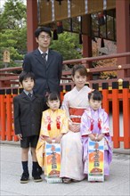 JAPAN, Honshu, Kyoto, "Fushimi-Inari Taisha, Fushimi-Ku Fukakusa Yabunouchi-cho.  Japanese family