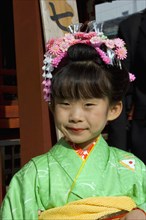 JAPAN, Honshu, Tokyo, Asakusa Kannon or Senso-ji Temple.  Head and shoulders portrait of young