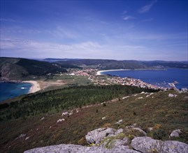 SPAIN, Galicia, View north from Cap Fisterra with Praia do Mar de Fora on the left and the village