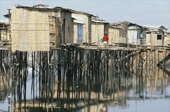 ECUADOR, Guayas Province, Guayaquil , Slum housing with stilt buildings built over untreated sewage