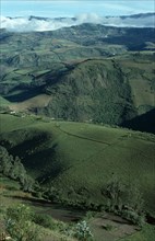 ECUADOR, Atahualpa, "Elevated view across tundra region with green hills, valleys and agricultural
