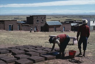 BOLIVIA, Altiplano, Machaca, Brick making. Near Machaca.