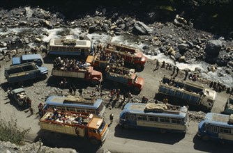 BOLIVIA, Yungas, "Road block on road to La Paz with view over buses, trucks and passengers at a