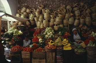 BOLIVIA, Sucre, "Market stall selling fruit , vegetables and locally made baskets"