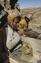 BOLIVIA, Chukiuta, Tin miners eating coca leaves