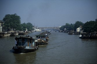 CHINA, Jiangsu Province, Transport, Barge train travelling down the Grand Canal between Suzhou and