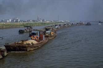CHINA, Jiangsu Province, Transport, Barge train travelling down the Grand Canal between Suzhou and