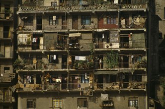 CHINA, Hubei, Badong, Detail of apartment blocks with washing lines and plants hanging from