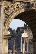 ITALY, Lazio, Rome, The three Corinthian columns of the Temple of Castor and Pollux and the walls