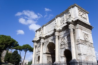 ITALY, Lazio, Rome, The south face of the triumphal Arch of Constantine with the Arch of Titus in