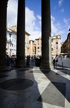 ITALY, Lazio, Rome, Piazza della Rotonda seen through the granite columns of the Pantheon with