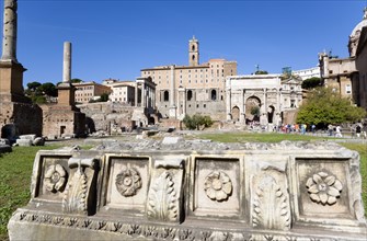 ITALY, Lazio, Rome, The Forum with tourists. Details of ruin fragments with the Arch of Septimius