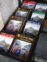 ITALY, Lazio, Rome, Display of guide books to the city and the Vatican in different languages