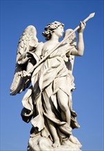 ITALY, Lazio, Rome, Statue of a winged female angel on the Ponte Sant Angelo bridge over the River
