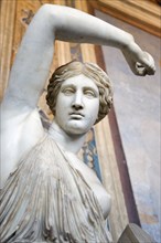 ITALY, Lazio, Rome, Vatican City Museums A statue of a woman raising her arm in the Room of The