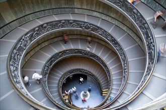 ITALY, Lazio, Rome, Vatican City Museums Tourists descending the Spiral Ramp designed by Giuseppe