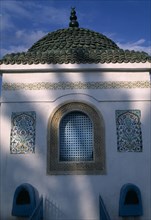 TUNISIA, Nabeul, "Part view of exterior of tomb with domed, tiled roof, arched window and