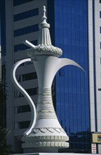 UAE, Abu Dhabi, "Fountain in the shape of a huge, traditional coffee pot in Al-Ittihad Square."