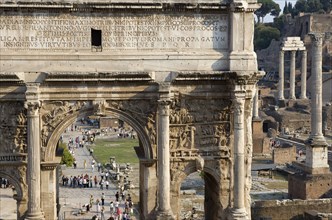 ITALY, Lazio, Rome, The Forum with the triumphal Arch of Septimus Severus in the foreground and the