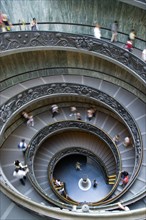 ITALY, Lazio, Rome, Vatican City Museum Tourists walking down the Spiral Ramp designed in 1932 by