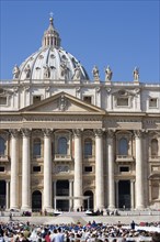 ITALY, Lazio, Rome, Vatican City The central facade of the Basilica of Saint Peter with crowds