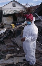 USA, Louisiana, New Orleans, "Aftermath of 2005 Hurricane Katrina, woman wearing protective