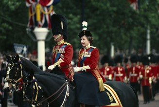ENGLAND, London, The Queen and The Duke of Edinburgh on horseback returning from Trooping the