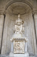 ITALY, Lazio, Rome, Colossal Statue of Sitting Rome Cesi Roma in a niche within the courtyard of