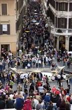 ITALY, Lazio, Rome, The Via dei Condotti the main shopping street busy with people seen from the