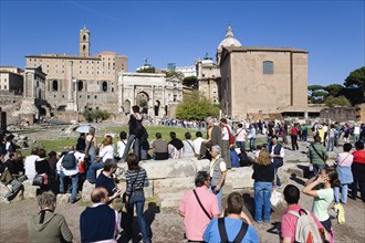 ITALY, Lazio, Rome, "The Forum and tourists with from left to right the columns of the Temple of