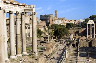 ITALY, Lazio, Rome, "Tourists in the Forum with from left the columns of the Temple of Saturn, the