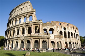 ITALY, Lazio, Rome, Tourists outside the Colosseum built by Emperor Vespasian in AD 69