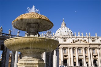 ITALY, Lazio, Rome, Vatican City The facade of the Basilica of St Peter with a water fountain and