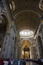 ITALY, Lazio, Rome, Vatican City Tourists in the main nave of St Peter's Basilica showing the