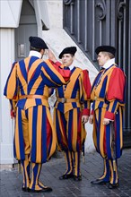 ITALY, Lazio, Rome, Vatican City Three Swiss Guards in full ceremonial uniform dress with two