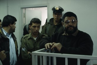 ISRAEL, Palestine , Gaza, Dr Abdel Aziz al Rantissi standing in a cage / dock inside an Israeli