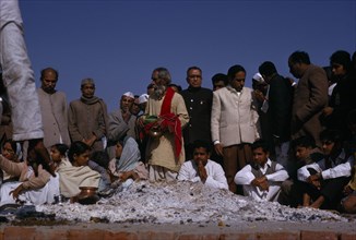 INDIA, Uttar Pradesh, Varanasi , Lal Bahadur Shastri’s funeral with mourners gathered around pyre.