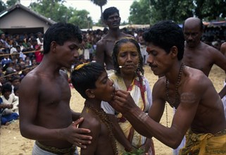 SRI LANKA, Religion, Hinduism, "Punnaccolai Festival. Tamil Oracle named Sothimalar with her son,