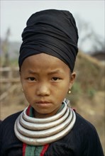 LAOS, Tribal People, Meo Tribe, Head and shoulders portrait of a Meo girl wearing traditional dress