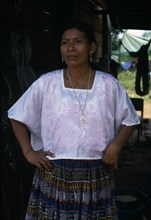GUATEMALA, Alta Verapaz, Sacaak , Portrait of a Q’eqchi Indian mother wearing a white blouse and a