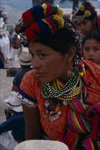 GUATEMALA, El Quiche, San Andres de Sacabaja, Quiche Indian woman wearing traditional colourful