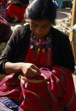 GUATEMALA, Chimaltenango, Patzun, Kakchiquel Indian woman making a huipile blouse