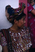GUATEMALA, El Quiche, Nebaj, Ixil Indian girl wearing traditional dress and an elaborate head-dress