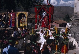 GUATEMALA, El Quiche, San Andres de Sajcabaja, Quiche Indians knelling in prayer to the saints